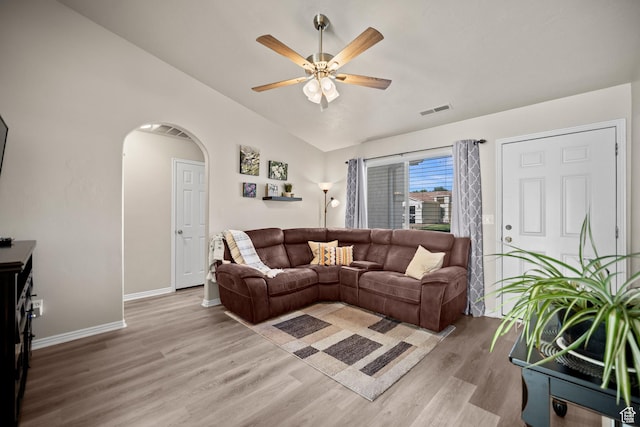 470 E 1100 S Unit 63, St George, UT 84790 - living room with vaulted ceiling, light wood-style floors, a ceiling fan, and arched walkways