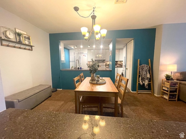 110 S 800 E Unit 300, Salt Lake City, UT 84102 - carpeted dining area featuring a chandelier and baseboards