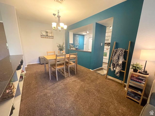 110 S 800 E Unit 300, Salt Lake City, UT 84102 - carpeted dining area featuring a chandelier and baseboards