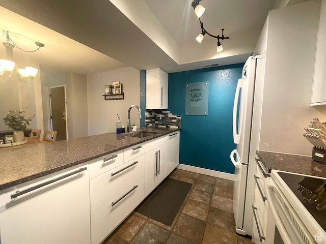 110 S 800 E Unit 300, Salt Lake City, UT 84102 - kitchen with white appliances, white cabinetry, and dark stone finish floors