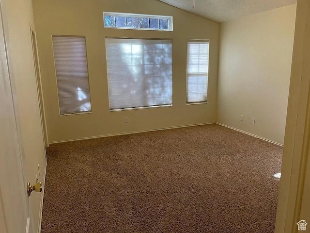 1118 E Chokeberry Dr, St George, UT 84790 - empty room with vaulted ceiling, carpet floors, and a ceiling fan