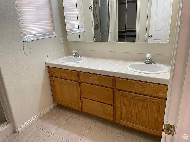 1118 E Chokeberry Dr, St George, UT 84790 - full bath featuring double vanity, tile patterned floors, and a shower with shower door