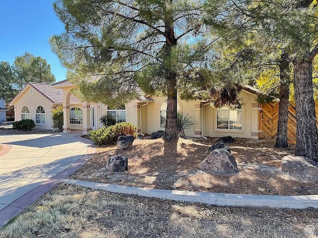 1118 E Chokeberry Dr, St George, UT 84790 - view of front of property featuring stucco siding and concrete driveway
