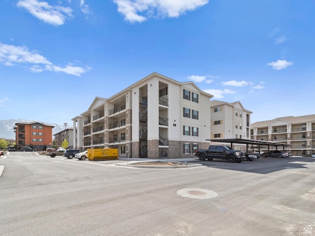 1140 W 950 N Unit C403, Orem, UT 84057 - view of property featuring covered and uncovered parking