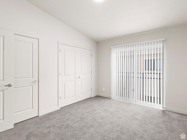 1140 W 950 N Unit C403, Orem, UT 84057 - unfurnished bedroom with vaulted ceiling, carpet flooring, and a closet