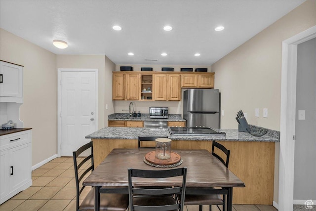 695 N 500 W # 5, St George, UT 84770 - kitchen with stainless steel appliances, light tile patterned floors, recessed lighting, open shelves, and stone counters