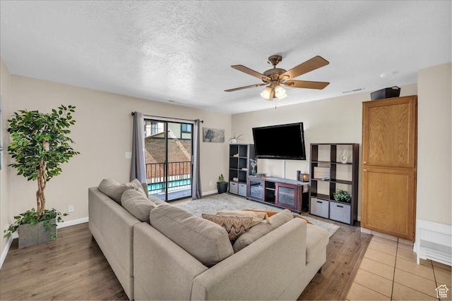 695 N 500 W # 5, St George, UT 84770 - living room with a textured ceiling, light wood-style floors, and ceiling fan