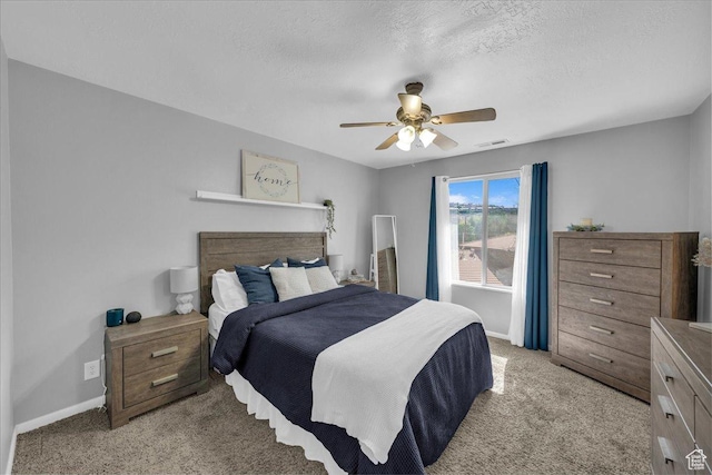 695 N 500 W # 5, St George, UT 84770 - bedroom featuring light colored carpet, a ceiling fan, and a textured ceiling