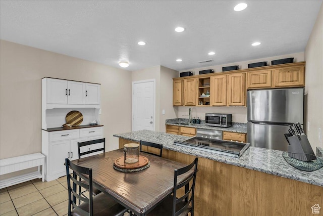 695 N 500 W # 5, St George, UT 84770 - kitchen featuring stainless steel appliances, light stone counters, open shelves, a peninsula, and recessed lighting