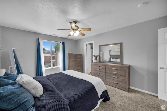 695 N 500 W # 5, St George, UT 84770 - bedroom with light colored carpet, ceiling fan, and a textured ceiling