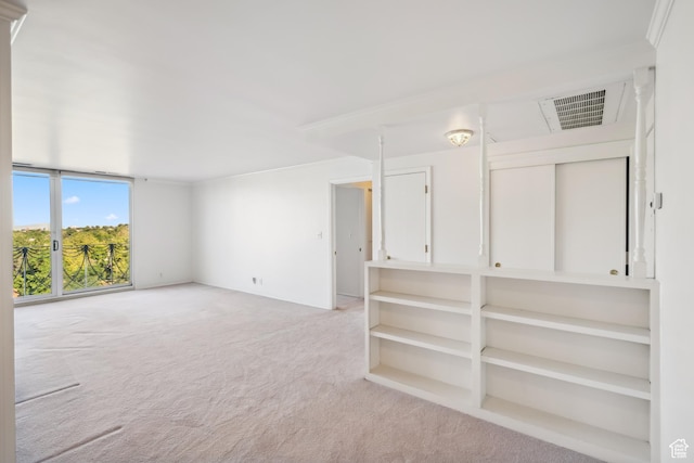 777 E S Temple N Unit 9J, Salt Lake City, UT 84102 - empty room with light colored carpet and crown molding
