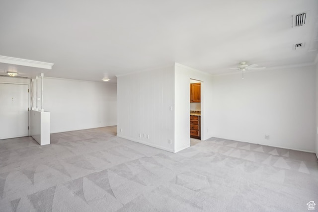 777 E S Temple N Unit 9J, Salt Lake City, UT 84102 - empty room featuring crown molding, a ceiling fan, and light colored carpet