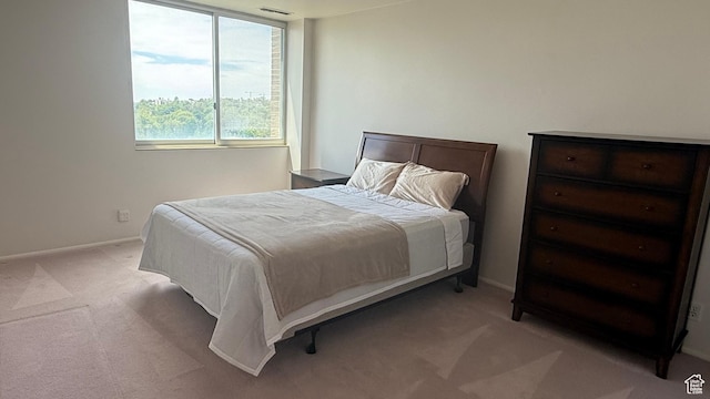 777 E S Temple N Unit 9J, Salt Lake City, UT 84102 - bedroom featuring light colored carpet