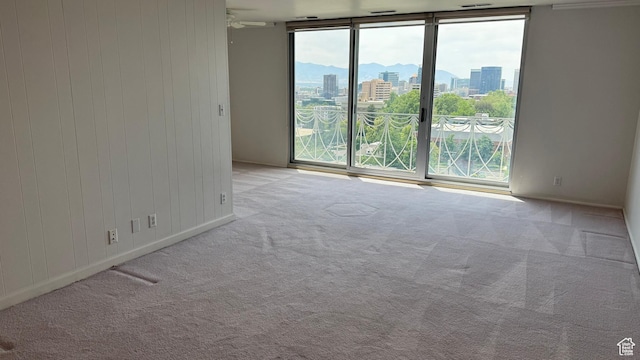 777 E S Temple N Unit 9J, Salt Lake City, UT 84102 - carpeted empty room with a view of city and floor to ceiling windows