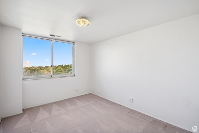 777 E S Temple N Unit 9J, Salt Lake City, UT 84102 - empty room featuring light colored carpet and baseboards