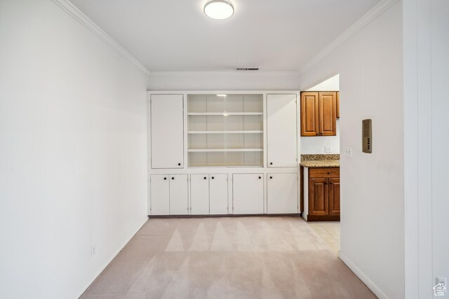 777 E S Temple N Unit 9J, Salt Lake City, UT 84102 - hallway with crown molding and light colored carpet