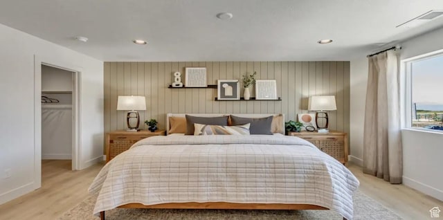 2158 W 2615 N Unit 137, Clinton, UT 84015 - bedroom featuring light wood-type flooring, a walk in closet, and recessed lighting