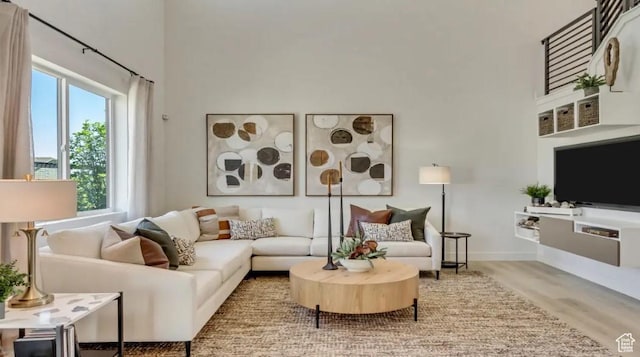 2158 W 2615 N Unit 137, Clinton, UT 84015 - living area with a towering ceiling and wood finished floors