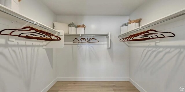 2158 W 2615 N Unit 137, Clinton, UT 84015 - walk in closet with light wood finished floors
