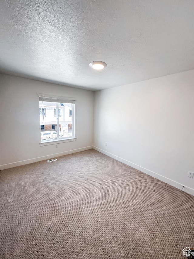 511 S 1225 W Unit 102, Logan, UT 84321 - unfurnished room with carpet flooring and a textured ceiling