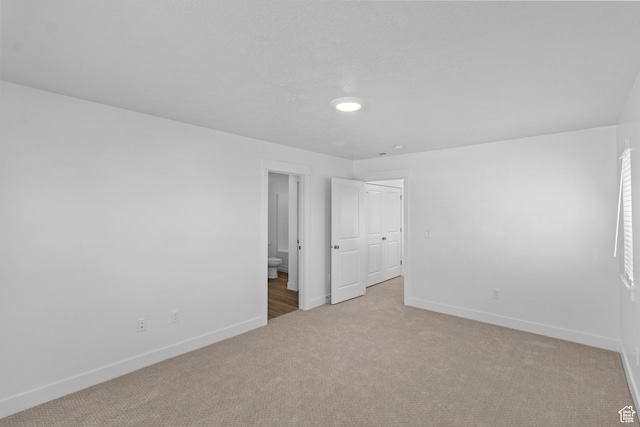 511 S 1225 W Unit 102, Logan, UT 84321 - unfurnished bedroom featuring light colored carpet and ensuite bathroom
