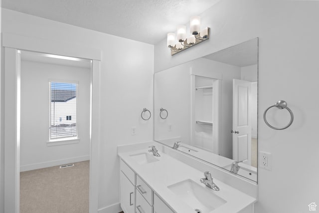 511 S 1225 W Unit 102, Logan, UT 84321 - full bath with double vanity and a textured ceiling