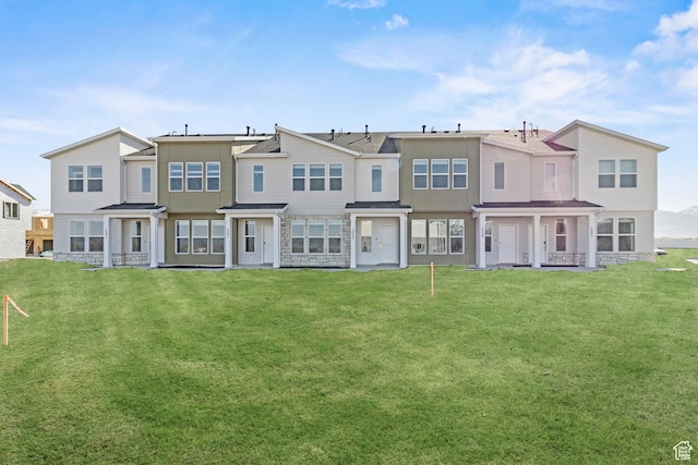 511 S 1225 W Unit 102, Logan, UT 84321 - back of house featuring a yard and stucco siding