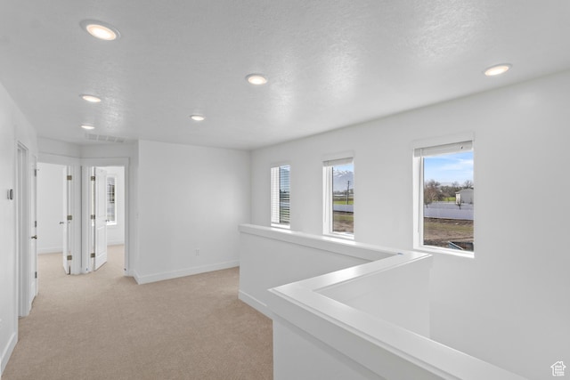 511 S 1225 W Unit 102, Logan, UT 84321 - hallway with recessed lighting and light colored carpet