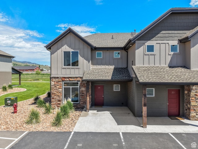 140 W 150 S Unit I34, Garden City, UT 84028 - view of property with board and batten siding, stone siding, and roof with shingles