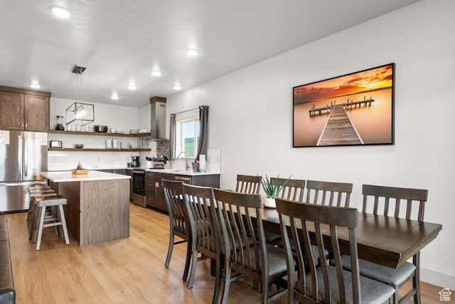 140 W 150 S Unit I34, Garden City, UT 84028 - dining space featuring light wood-type flooring and recessed lighting