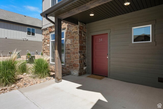 140 W 150 S Unit I34, Garden City, UT 84028 - view of exterior entry featuring stone siding and a patio area