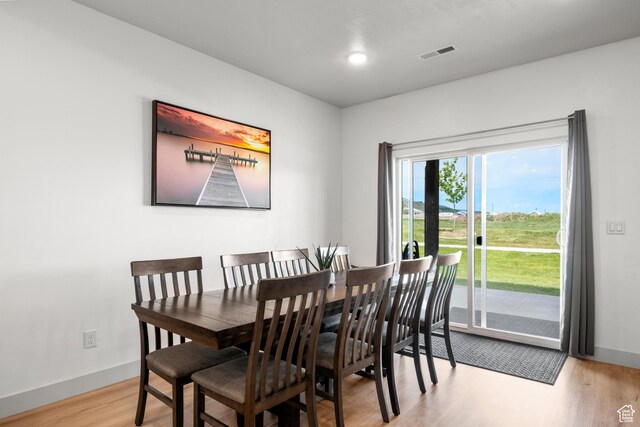 140 W 150 S Unit I34, Garden City, UT 84028 - dining area with wood finished floors and baseboards