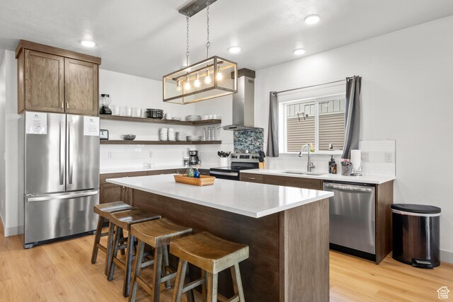 140 W 150 S Unit I34, Garden City, UT 84028 - kitchen featuring stainless steel appliances, extractor fan, open shelves, light wood-style flooring, and recessed lighting