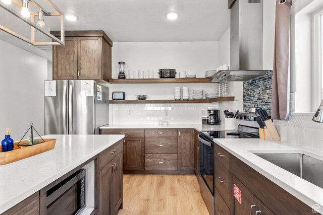 140 W 150 S Unit I34, Garden City, UT 84028 - kitchen with range with electric cooktop, freestanding refrigerator, range hood, and open shelves
