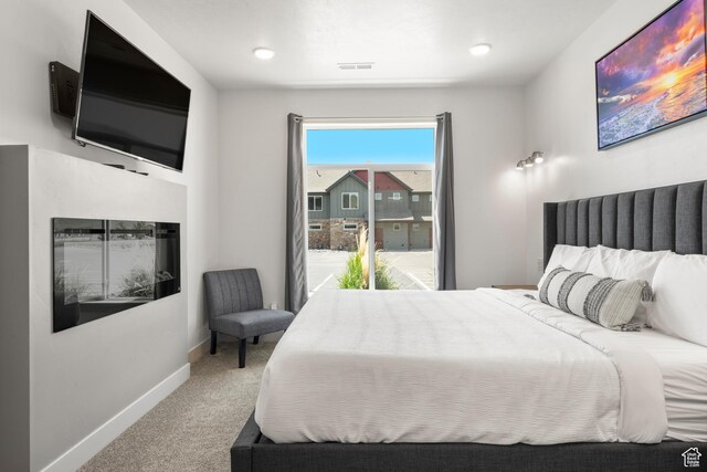 140 W 150 S Unit I34, Garden City, UT 84028 - carpeted bedroom featuring baseboards and access to outside