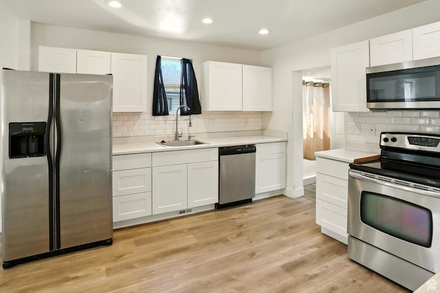 840 E 22nd St S, Ogden, UT 84401 - kitchen featuring stainless steel appliances, white cabinetry, light countertops, and recessed lighting