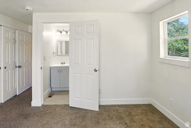 840 E 22nd St S, Ogden, UT 84401 - unfurnished bedroom with carpet flooring and ensuite bathroom