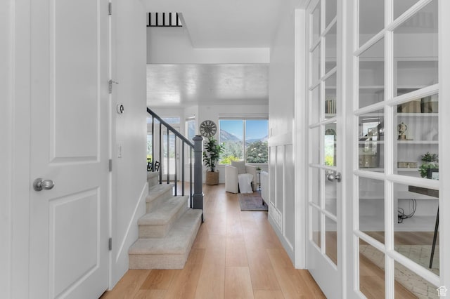 68 N Eden Way, Vineyard, UT 84059 - entrance foyer with light wood-style flooring, stairway, and french doors