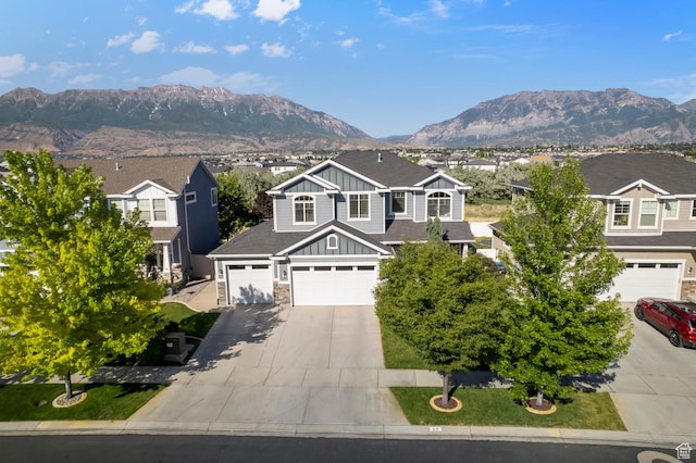 68 N Eden Way, Vineyard, UT 84059 - view of front of property featuring board and batten siding, concrete driveway, a mountain view, and an attached garage