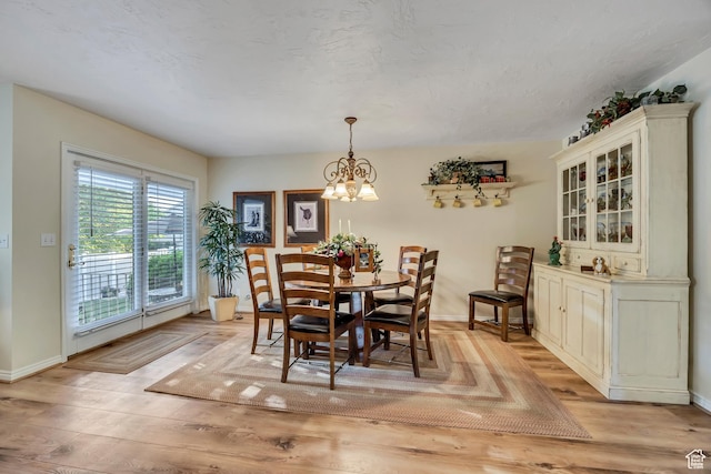 145 N 240 E, Orem, UT 84057 - dining area featuring a chandelier and light wood finished floors