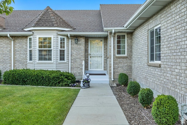 145 N 240 E, Orem, UT 84057 - view of exterior entry featuring a lawn and roof with shingles