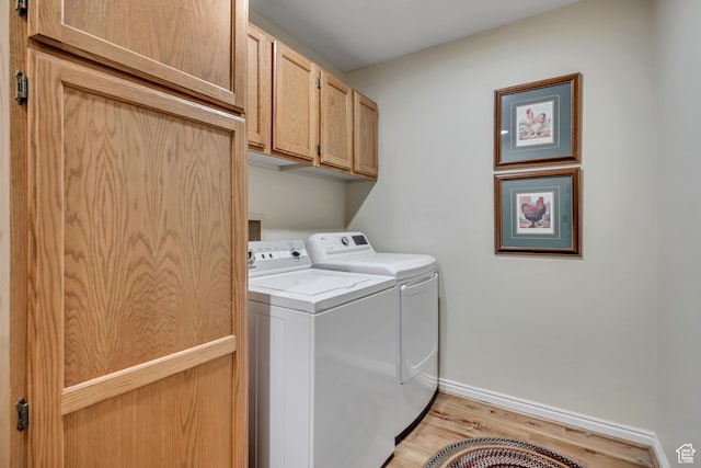 145 N 240 E, Orem, UT 84057 - washroom featuring washing machine and dryer, cabinet space, and light wood-style floors