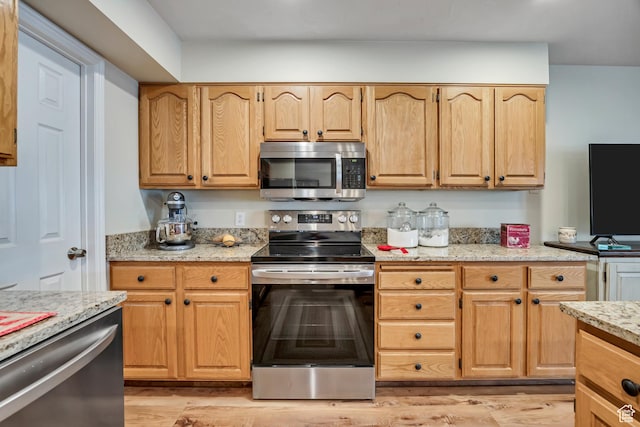 145 N 240 E, Orem, UT 84057 - kitchen with appliances with stainless steel finishes, light wood-style flooring, and light stone countertops