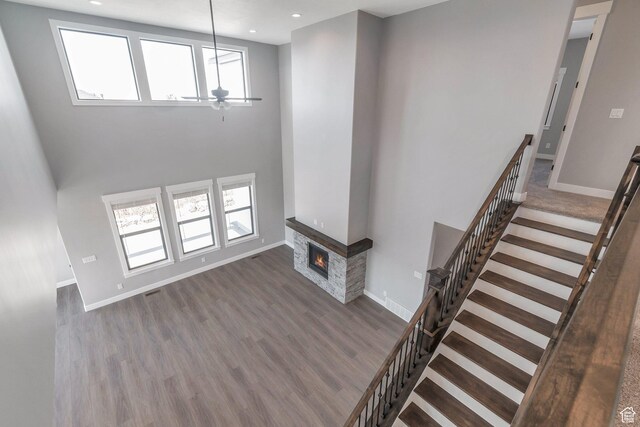 1766 S 1850 W Unit 08, Mapleton, UT 84664 - unfurnished living room with a ceiling fan, wood finished floors, plenty of natural light, a glass covered fireplace, and recessed lighting