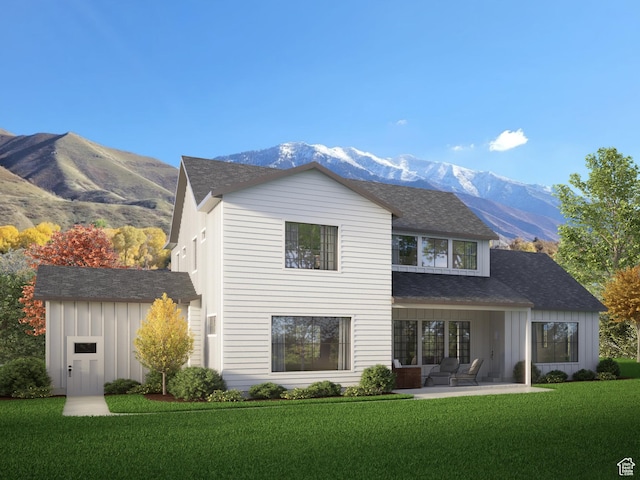 1766 S 1850 W Unit 08, Mapleton, UT 84664 - rear view of house featuring board and batten siding, a mountain view, a lawn, and a patio area