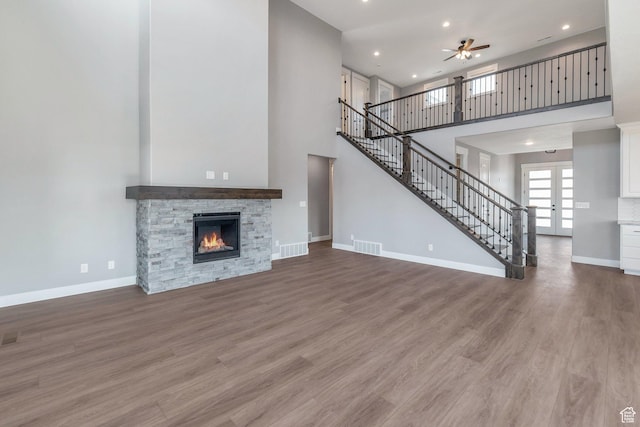 1766 S 1850 W Unit 08, Mapleton, UT 84664 - unfurnished living room featuring a towering ceiling, a ceiling fan, stairs, recessed lighting, and wood finished floors