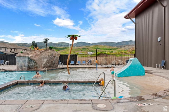 175 S Blue Topaz Ln, Garden City, UT 84028 - community pool with a mountain view, a patio area, and a community hot tub
