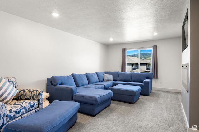 175 S Blue Topaz Ln, Garden City, UT 84028 - living room with light colored carpet, a textured ceiling, and recessed lighting