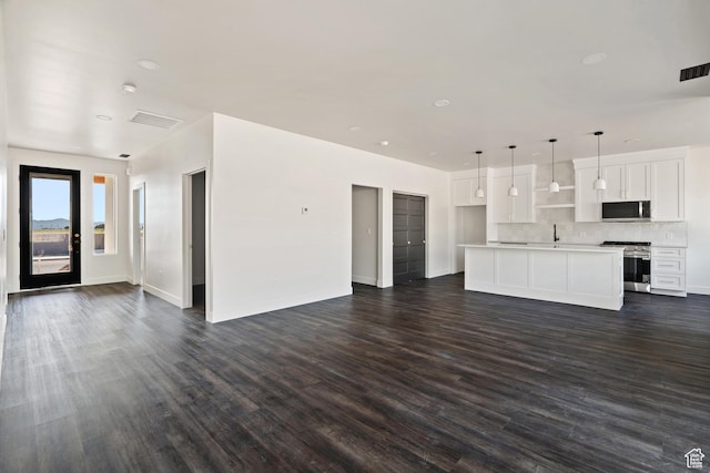 2639 S Mann Ln, Cedar City, UT 84720 - unfurnished living room featuring dark wood-style flooring