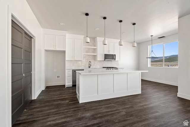 2639 S Mann Ln, Cedar City, UT 84720 - kitchen featuring open shelves, appliances with stainless steel finishes, white cabinetry, light countertops, and backsplash